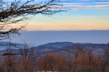 smog strip under  the snowy mountains
