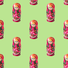 Russian doll matryoshka or babushka seamless pattern on light green background. Moscow traditional...