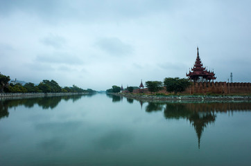 Mandalay Palace wall and moat under grey sky, Myanmar