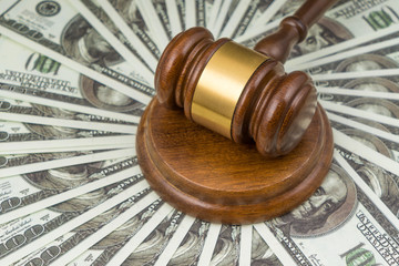 Gavel judge and dollars money banknotes. Close-up. Concept, tax time, court law