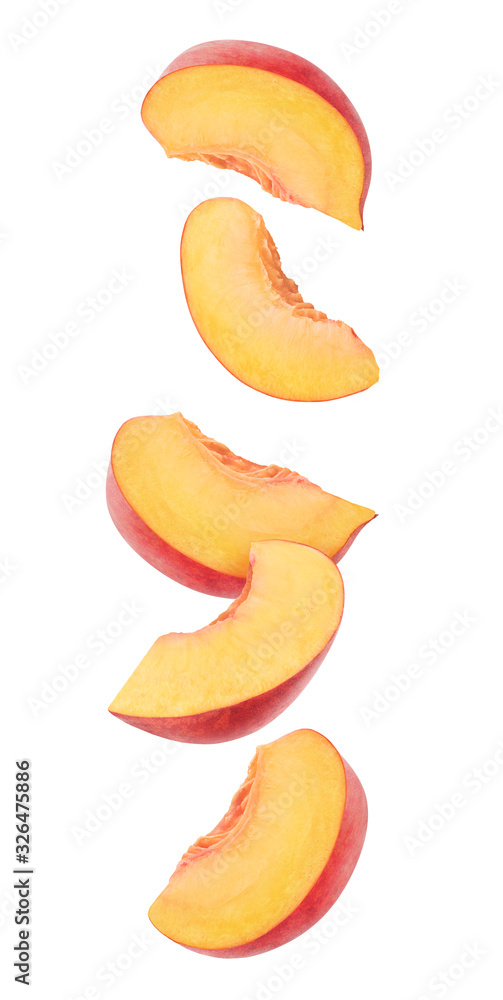 Wall mural Peach fruit pieces in the air. Five slices of fresh peach falling over white background