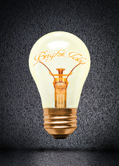 Illuminated Light Bulb With Bright Idea Text and Copy Space
