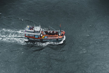 Obraz premium Lonely fisherman deep in the sea near coast of Vietnam