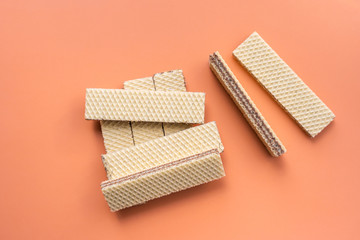 Wafer cookies on red background. Top view.