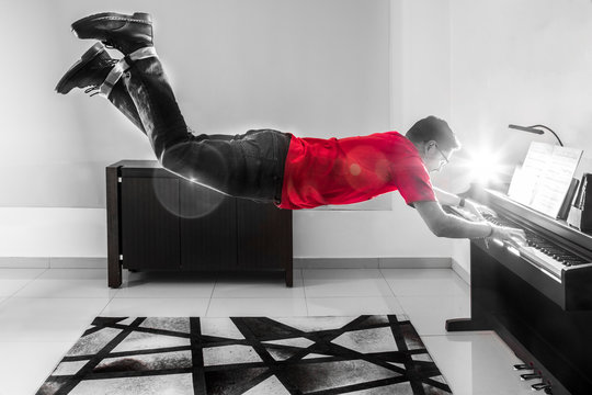 Man playing the piano floats and levitates