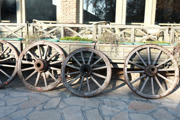 Fototapeta na wymiar Old wooden wheels from wagon