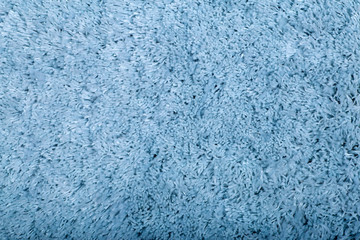 Carpet covering background. Pattern and texture of blue colour carpet. Copy space