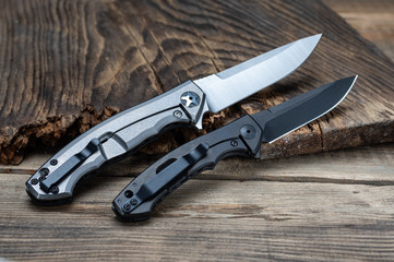The reverse side of the knives. American knives. Black and white knife.
