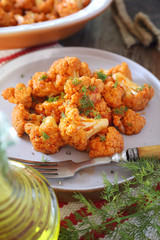 Vegetarian food: spicy roasted cauliflower in tomato sauce and olive oil