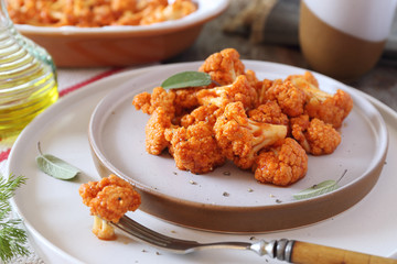 Vegetarian food: spicy roasted cauliflower in tomato sauce and olive oil