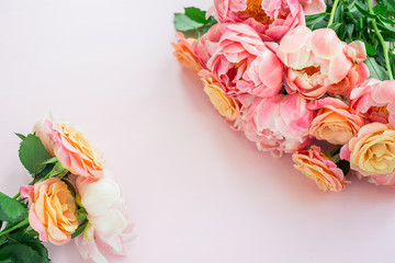 Fresh bunch of pink peonies and roses on pink background. Card Concept, pastel colors, close up image, copy space