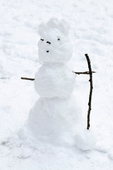 White snowman of three balls in the park