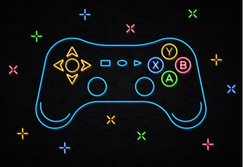 Neon game controller for video games on black brick wall. Glowing outline gamepad icon with color decorative elements concept. Neon light graphic design. Arrow key direction button vector illustration