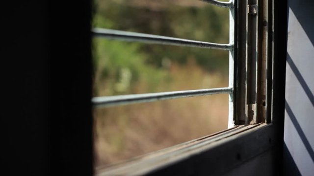 Indian train window with bars, shallow DOF