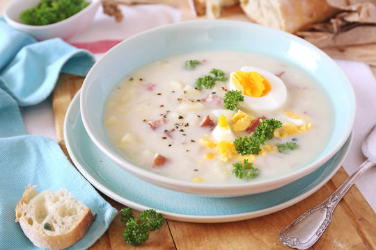 Traditional polish soup Zurek. Sour soup with sausage,  potatoes and eggs