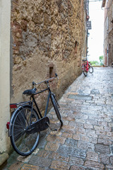 Fototapeta na wymiar two old bicycle on the street