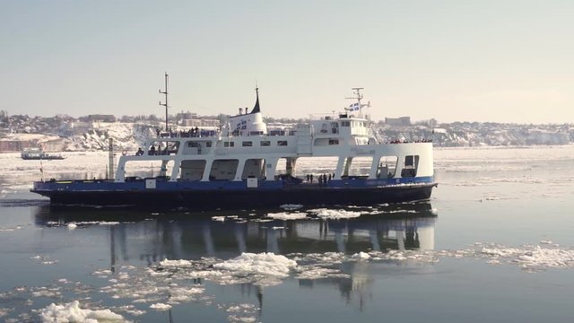 Passenger Ferry crosses the frozen St Lawrence river from Levis to Quebec City