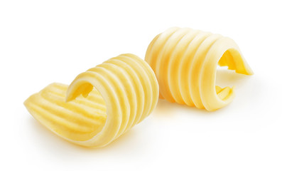 Butter curls or butter rolls isolated on white background - obrazy, fototapety, plakaty
