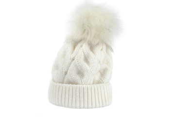 White winter hat with pompom on a white background..