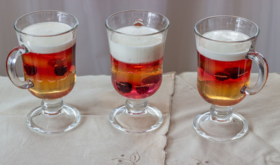 Multi-colored jelly and yogurt with the blackberries in a glass dessert bowl. Gelatin dessert for children. Delicious healthy food.
