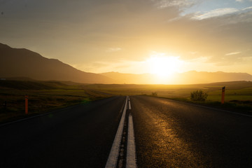Street leading into beautiful sunset, iceland