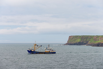 Small fishing boat at sea. Fishing industry.