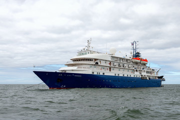 Fototapeta na wymiar Blue cruise ship at sea. Passenger vessel. 