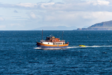 Small passenger vessel. Brown cruise ship at sea. 