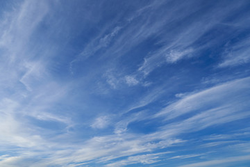 Bright beautiful blue sky with soft clouds for background or texture