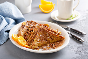 Cinnamon pecan french toasts with coffee for breakfast