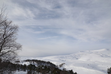 winter mountain landscape with mountains and blue sky