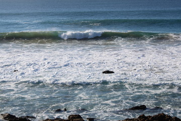 waves breaking on the rocks