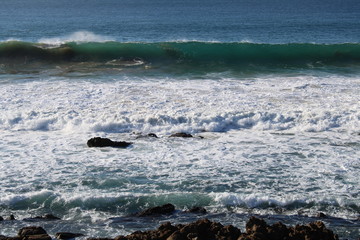 waves crashing on rocks