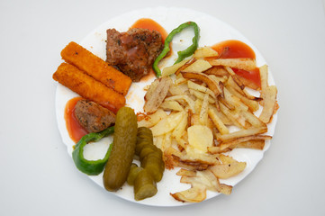 platter with French fries, pickles and fish
