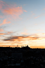 Image of the sunset in the city of Barcelona with monjuic mountain silhouette