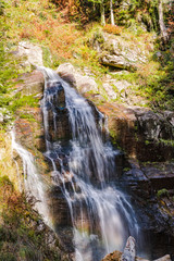 Fototapeta na wymiar Majestic Hidden Waterfall in Natural Landscape in Mountains