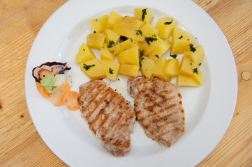 grilled pork and boiled potatoes