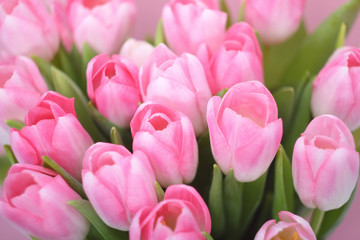 Obraz premium Close up of pink tulips flowers bouquet. Women, Mothers, Valentine's Day, birthday, spring greeting card. Background.