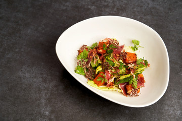 Smoked duck meat with baked pumpkin and lettuce leaves
