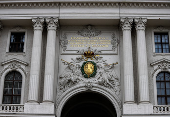 Reliefs and two pairs of columns at the entrance of the Hofburg Imperial Palace, Michaelerplatz in Vienna, Austria.
