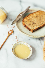 Salted honey butter on toast, marble background