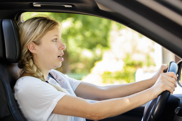 frightened female driver in car