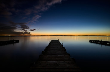 Fototapeta na wymiar walkways on a lake at dusk
