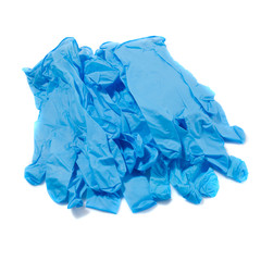 pile of blue medical gloves on white a background