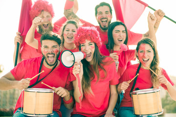 Football fan with red t-shirts before the entrance to the stadium. Group of young people very excited about football.  Sport and fun concept - Image