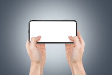 3D Rendering of Full Screen Phone Mock Up and Hand Holding on Dark