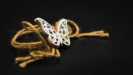 wooden butterfly with rope
