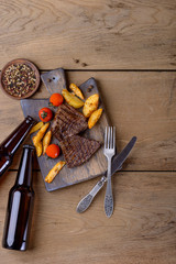 Steak and beer and potato