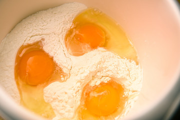Eggs in flour ready to make pancakes