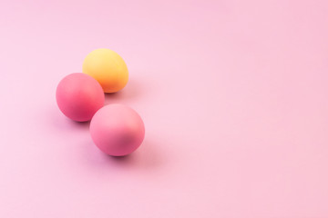 Easter eggs on pink background. Copyspace.
